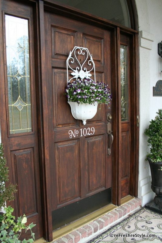 Pansies in a metal container for door decor