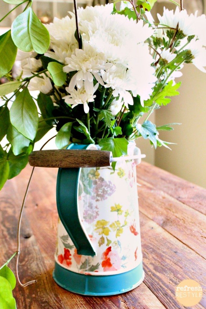 fresh flowers in a watering can