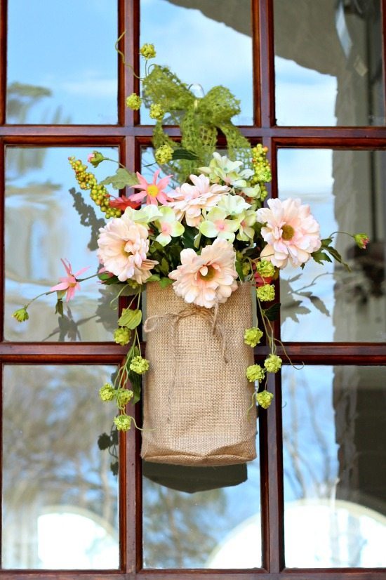 Corals, greens, pinks flowers in burlap bags