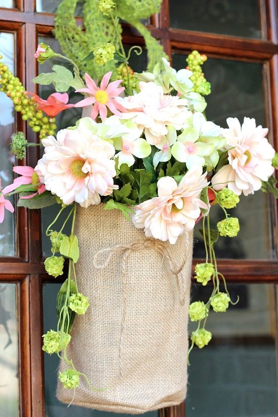 Spring flowers in burlap bags for the front door