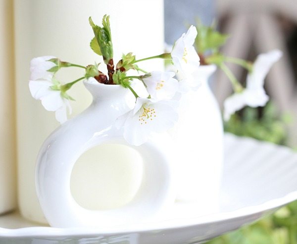 White flowers in napkin ring vases