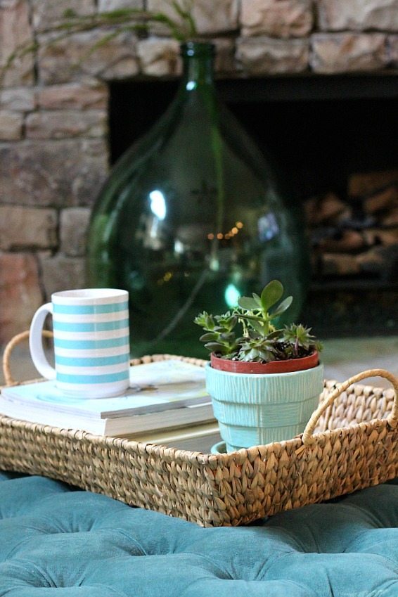 Basket on the ottoman, great for holding magazines or a cut striped cup of coffee