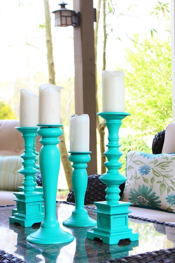 Patio refreshes with tall aqua candlesticks