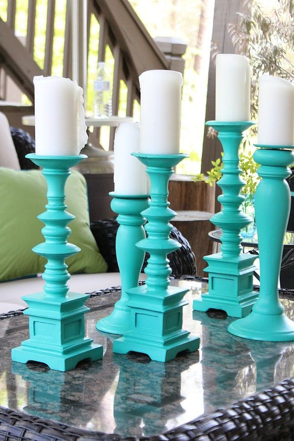 Spray paint large candle holders for a beautiful aqua statement