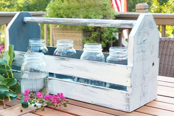 Mason jars and flowers in a wood tool box