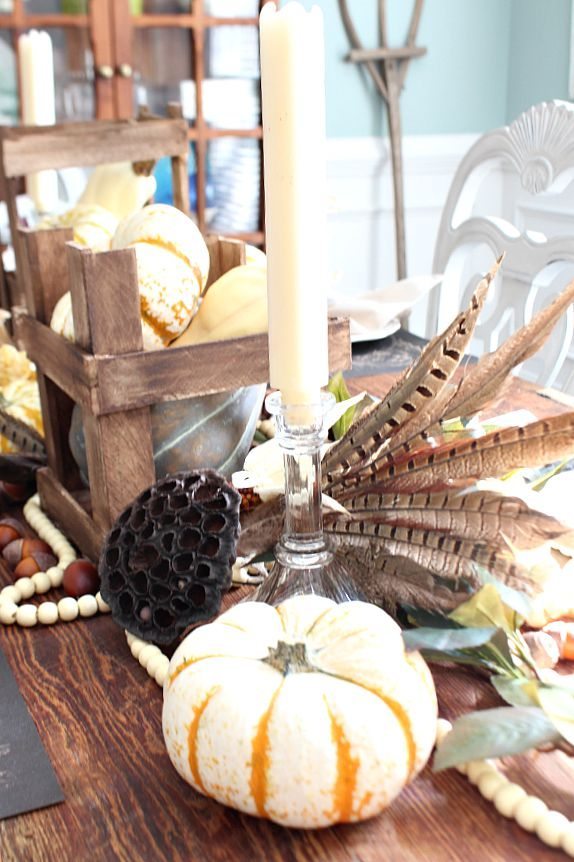 Beautiful feathers add texture to this fall tablescape refreshrestyle.com