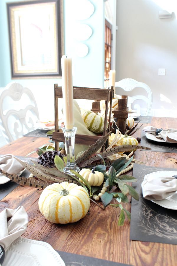 Pumpkins and feathers on the farm table refreshrestyle.com