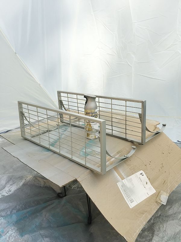 Spray painting shelves in my HomeRight spray shelter at refreshrestyle.com