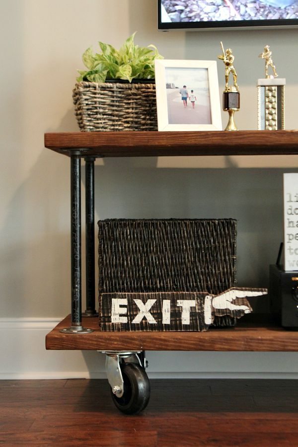 Wood and Pipes with huge casters on the how to create the perfect tv console at refreshrestyle.com