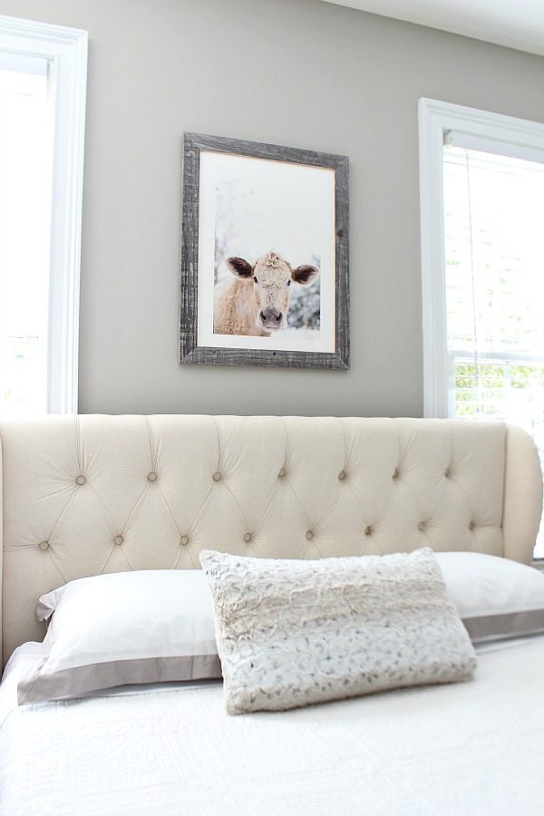 Moo Cow Minted Art above the bed in the guest room at refreshrestyle.com