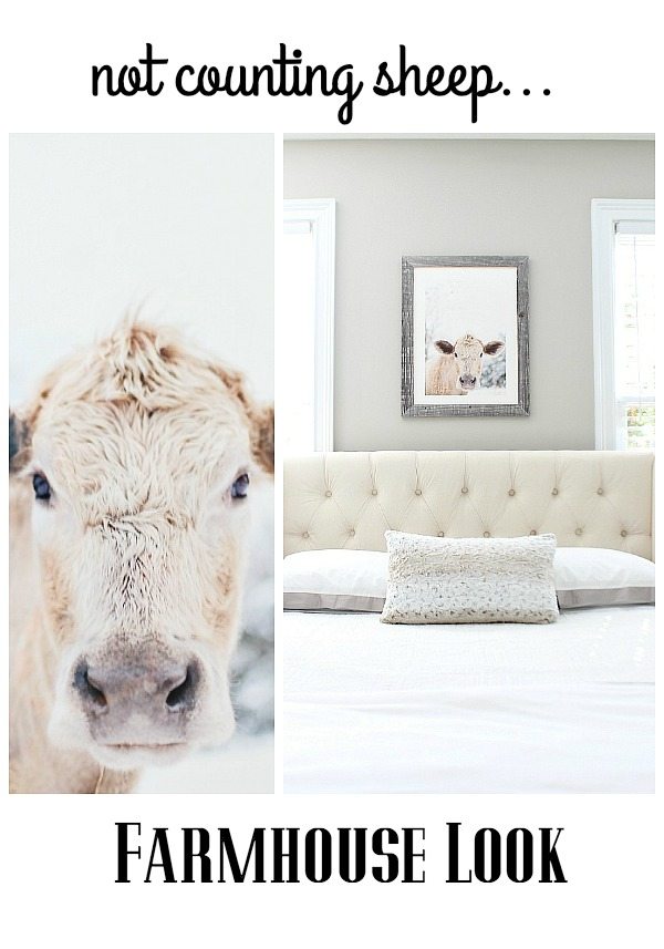 Neutral bedroom with fun moo cow art over the bed at refreshrestyle.com