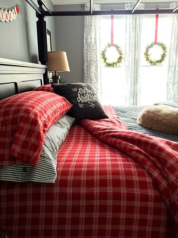 Master bedroom with reds and grays at Christmas