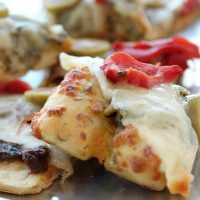 Easy Pizza Appetizer Roasted red peppers taste great. Pizza Bites quick and delicious with Pesto and roasted red peppers Mezzetta Olives