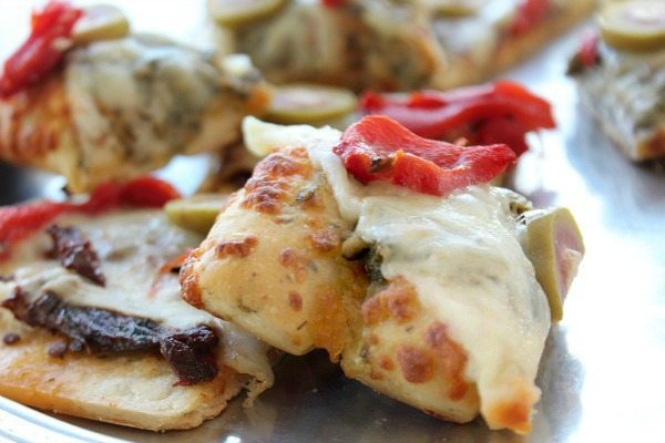 Roasted red peppers taste great. Pizza Bites quick and delicious with Pesto and roasted red peppers Mezzetta Olives
