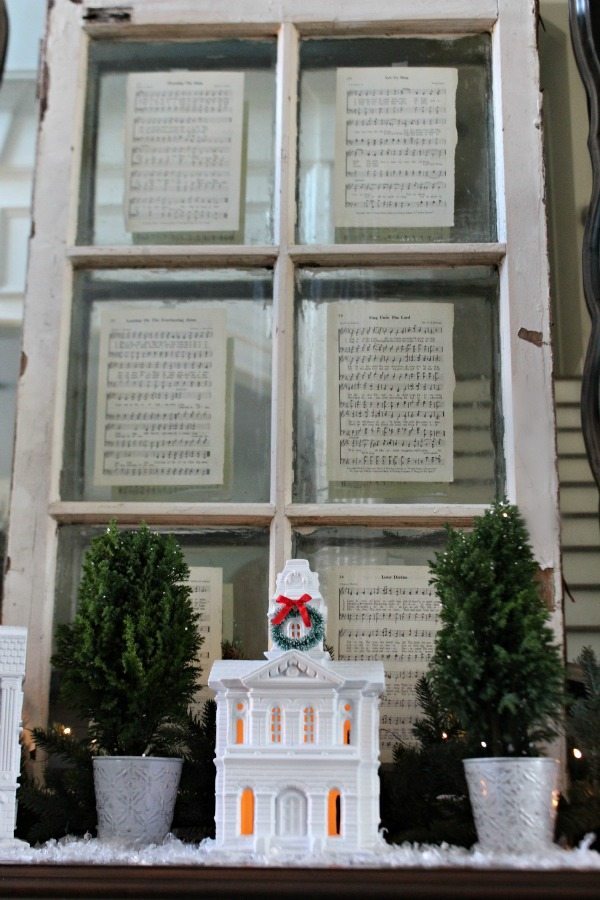 Old window with pages from an old hymnal perfect Christmas display at Refresh Restyle