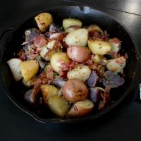 Iron skillet oven roasted potato recipe, filled with flavor and bacon