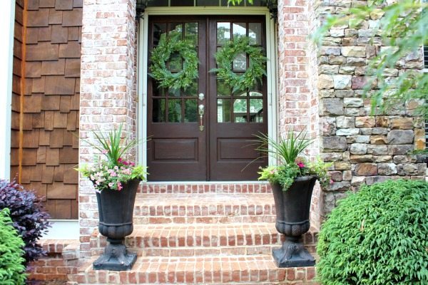 Double doors that say welcome to Refresh Restyle