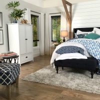 Light gray walls and dark blinds - Farmhouse Bedroom in Navy with shiplap wall and padded headboard at Refresh Restyle