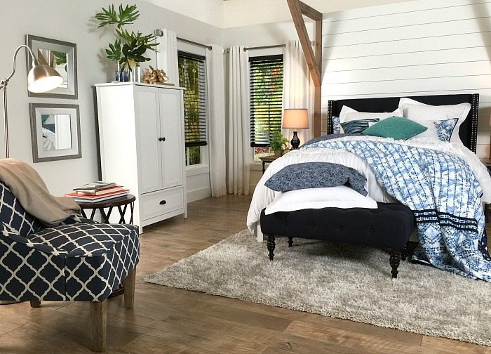 Light gray walls and dark blinds - Farmhouse Bedroom in Navy with shiplap wall and padded headboard at Refresh Restyle