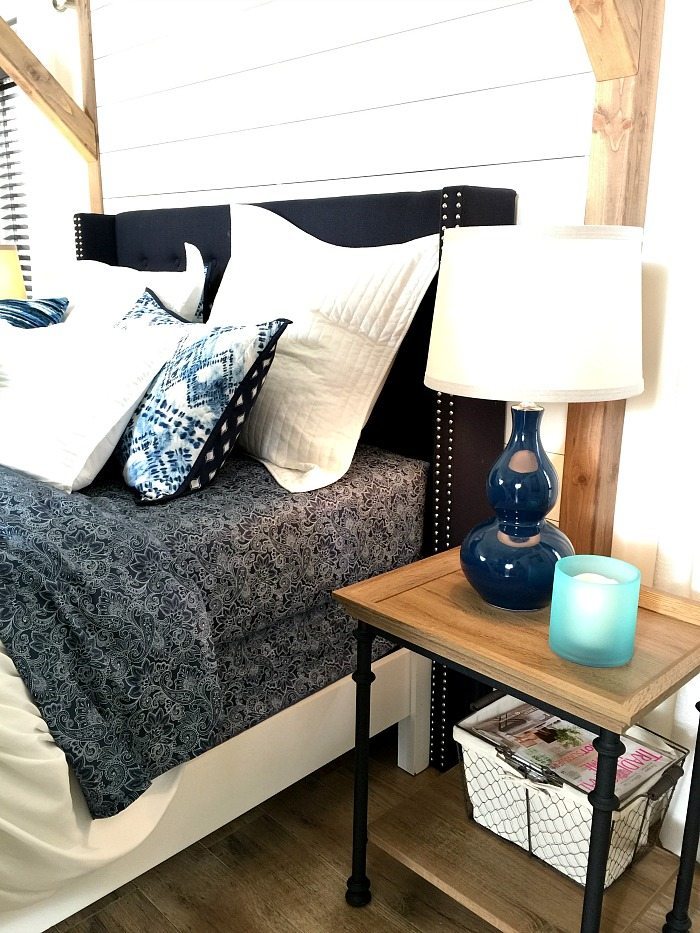 Navy and White Farmhouse Bedroom with shiplap wall and padded headboard at Refresh Restyle