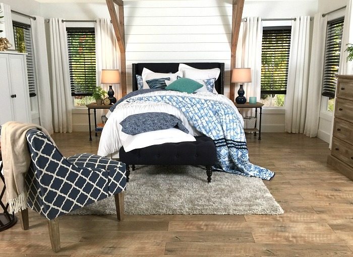 Shiplap behind the bed - Farmhouse Bedroom in Navy with shiplap wall and padded headboard at Refresh Restyle