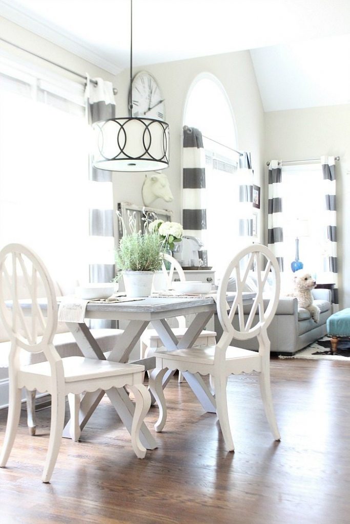 Farm table painted gray with x-base love the light and bright dining area