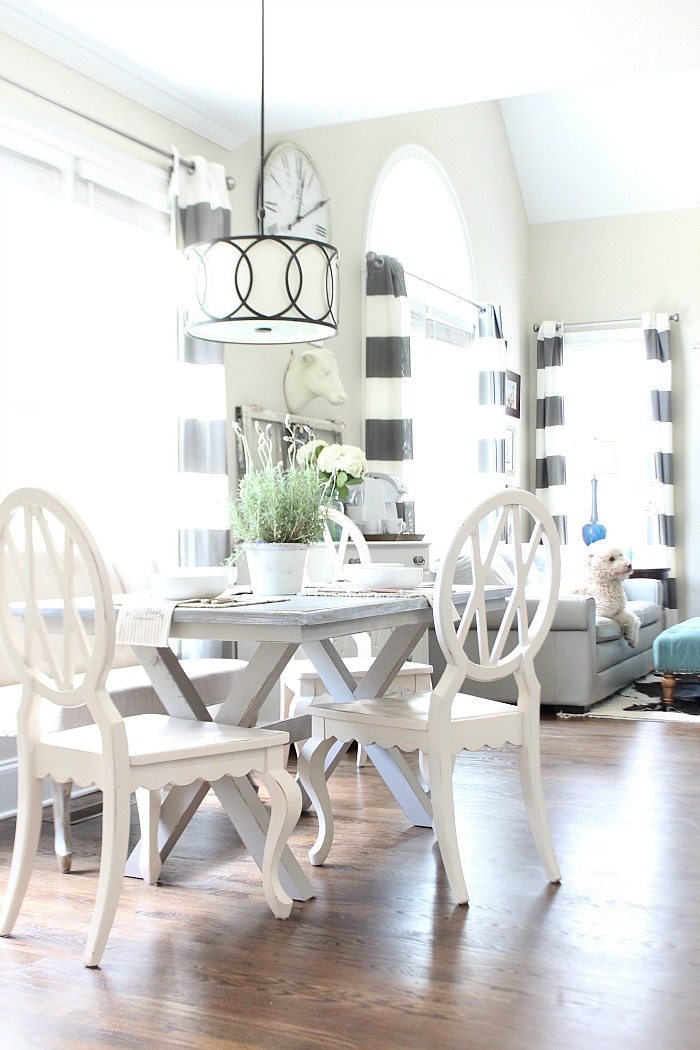 Farm table painted gray with x-base love the light and bright dining area - DIY furniture makeover from brown to fabulous gray 