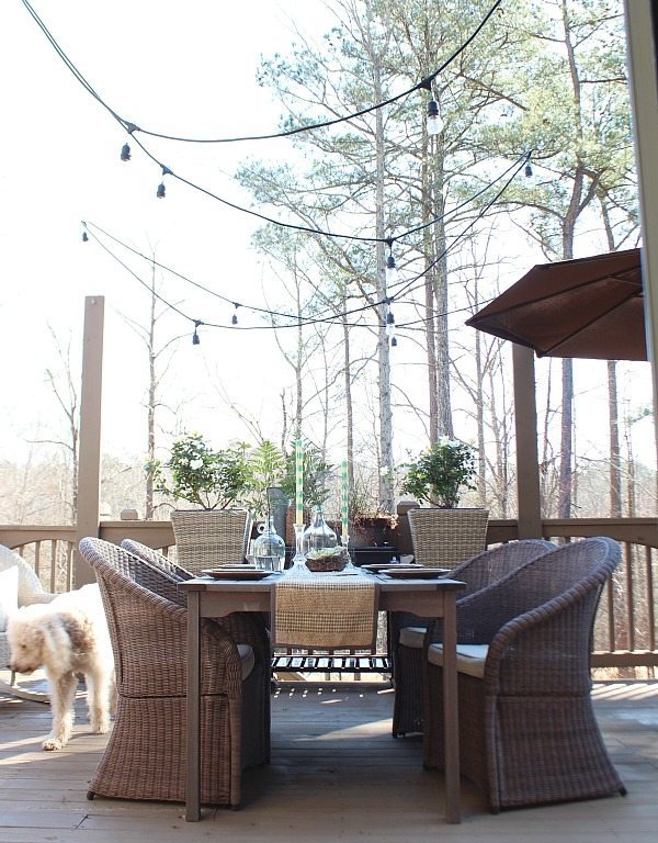 Set the table with thrifty wine bottles used for vases