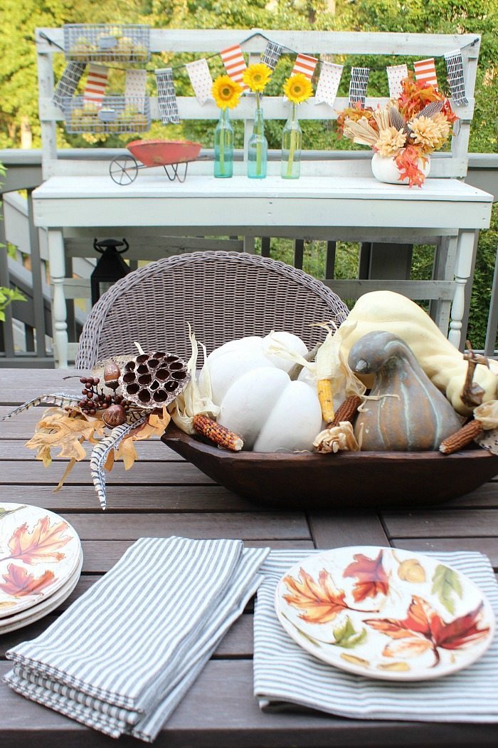 dough-bowl-filled-with-faux-pumpkins-on-the-back-porch-at-refresh-restyle