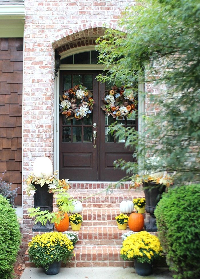 fall-front-porch-with-pumpkins-and-mums-plus-dark-stained-wood-doors-at-refresh-restyle