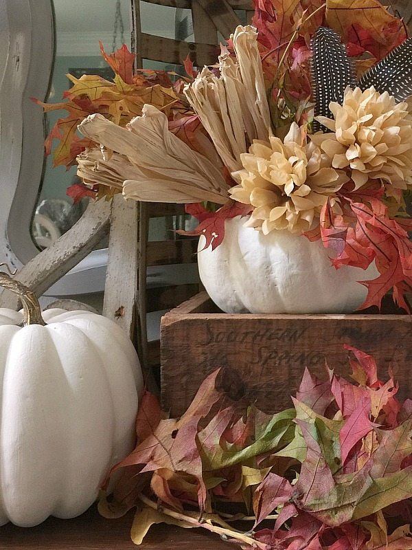 Feathers mums and corn husk in white pumpkins at Refresh Restyle