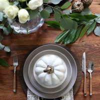 farm-table-set-with-pumpkin-bowls-stoneware-and-cooper-silverware