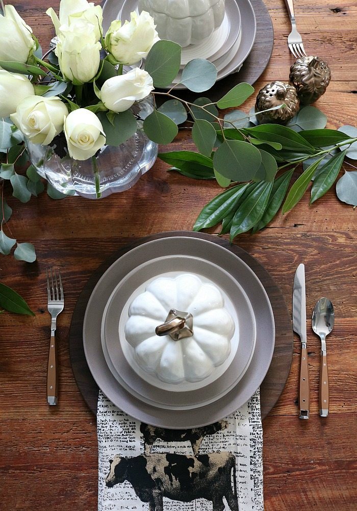 farm-table-set-with-pumpkin-bowls-stoneware-and-cooper-silverware