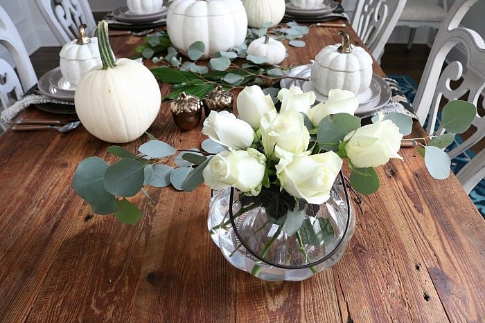 neutral-farmhouse-table-filled-with-white-pumpkins-and-white-roses