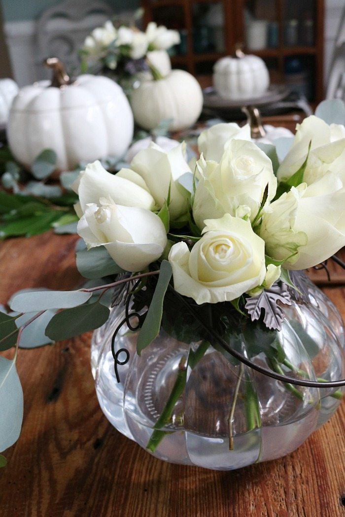 white-roses-in-pumpkin-candle-holder-perfect-for-a-low-profile-arrangement