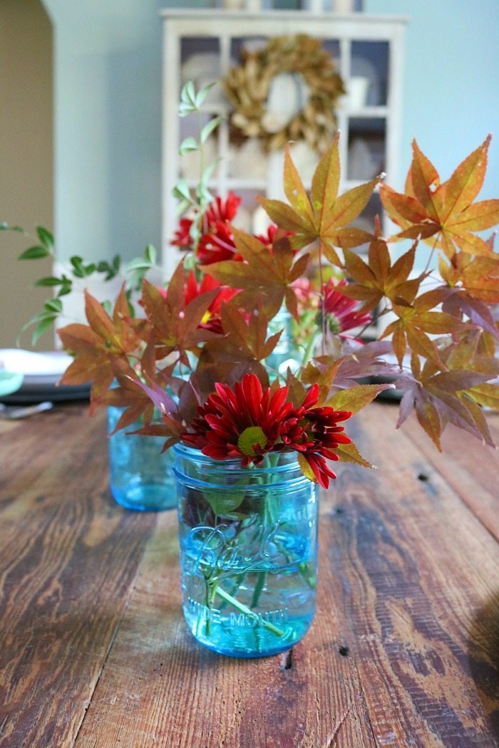 fill-blue-mason-jars-with-leaves-from-the-yard-for-a-pretty-centerpiece