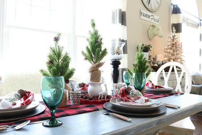 Plaid runner and trees wrapped in burlap for the Christmas table