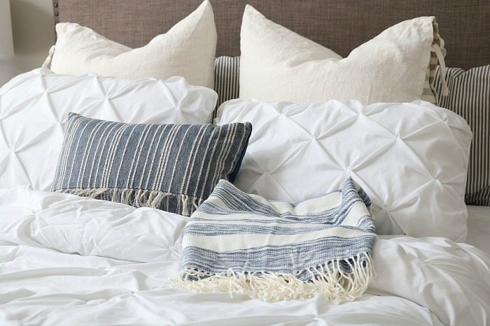 Love the mix of whites and blues - perfect for a relaxing bedroom. Loving indigo right now!