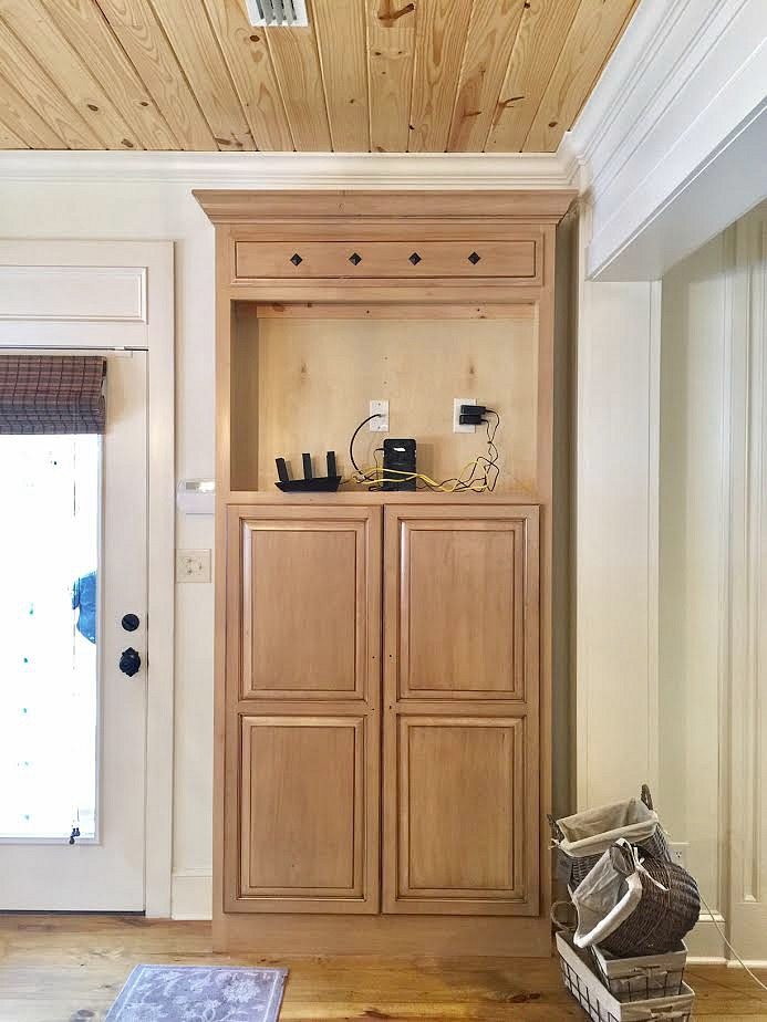 Before tv cabinet is now a mudroom closet