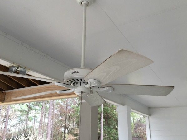 Clean outdoor fan blades with vinegar and water or a degreaser every season