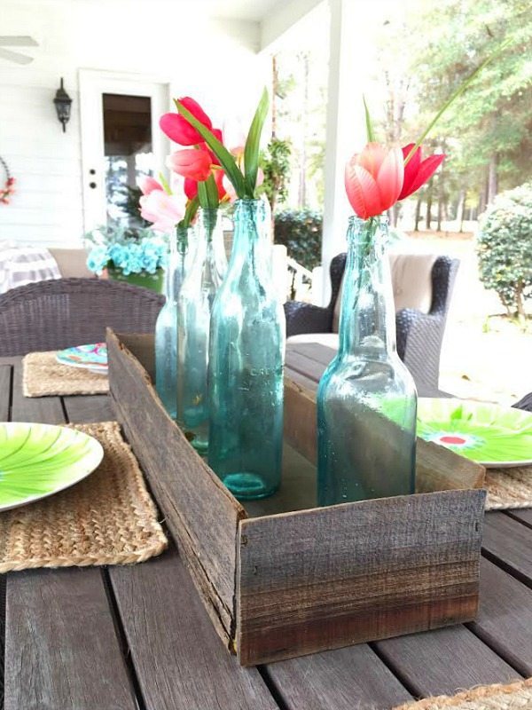 Barn wood box with old bottles for a farmhouse centerpiece