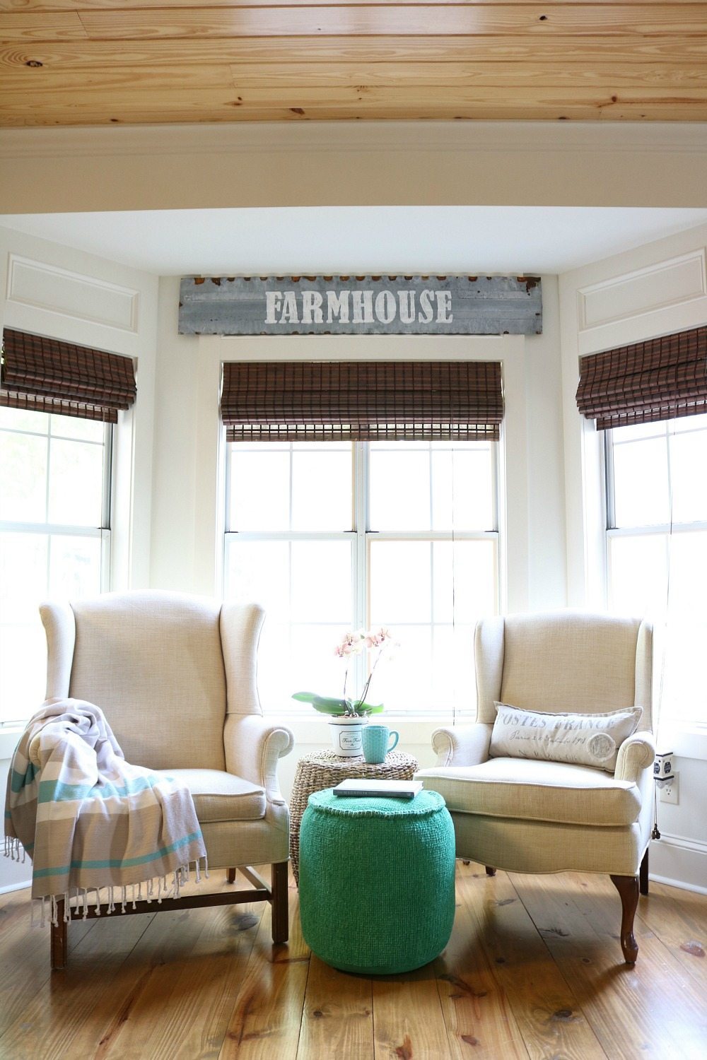 Cozy corner in the kitchen perfect for this metal farmhouse sign