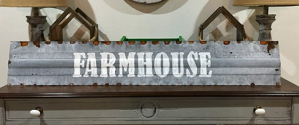 Farmhouse metal sign hand painted on the top of chicken feeder