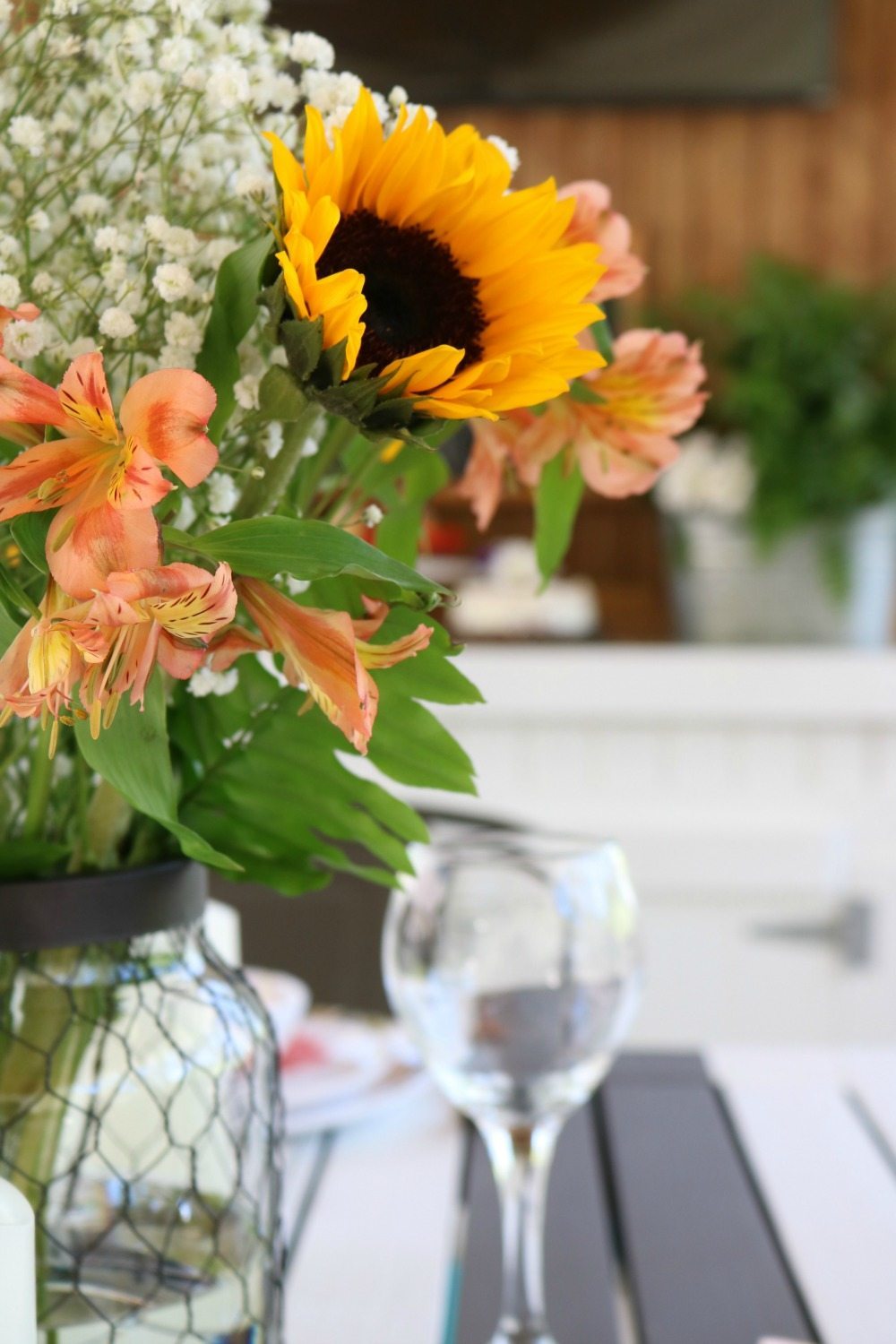 Grocery store flowers in Better Homes and Gardens chicken wire candle holder