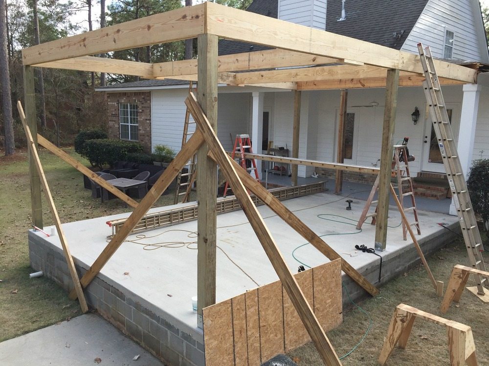 Posts up just the beginning of a roof over the patio at Refresh Restyle