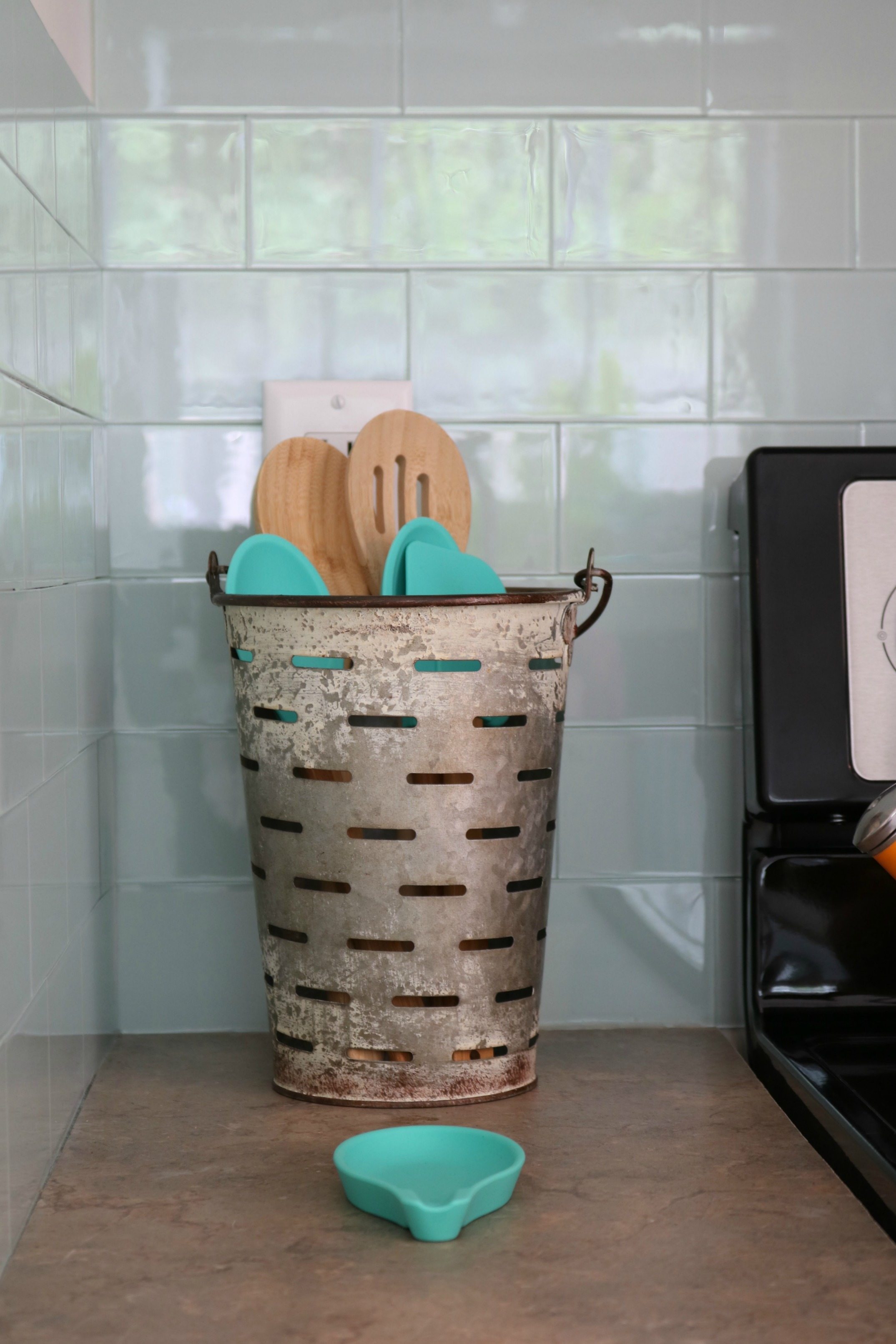 The cutest faux olive bucket for holder spatulas and large spoons farmhouse for sure