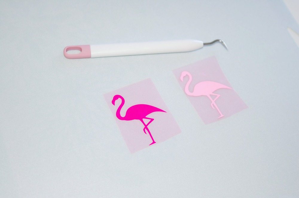 Cricut pink flamingos project weeding the vinyl