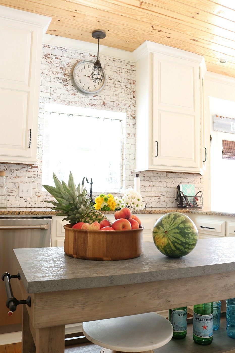 Painted-brick-shiplap-ceiling-and-white-cabinets-farmhouse-looking-kitchen