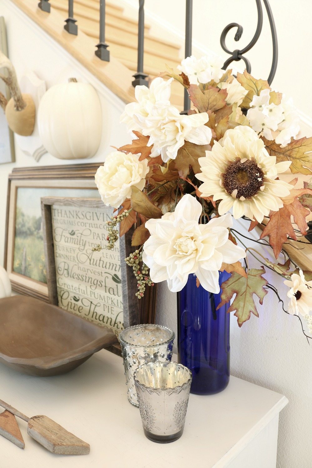 Cream flowers in a blue vase for fall