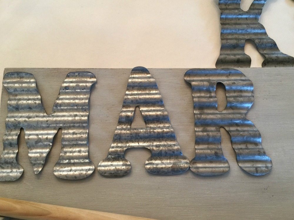 Add galvanized letters to sign